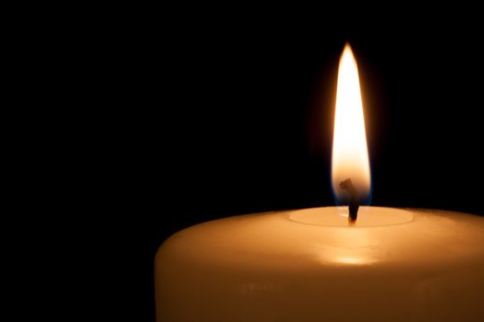 A yahrzeit candle is lit as a traditional ritual of mourning in Jewish culture