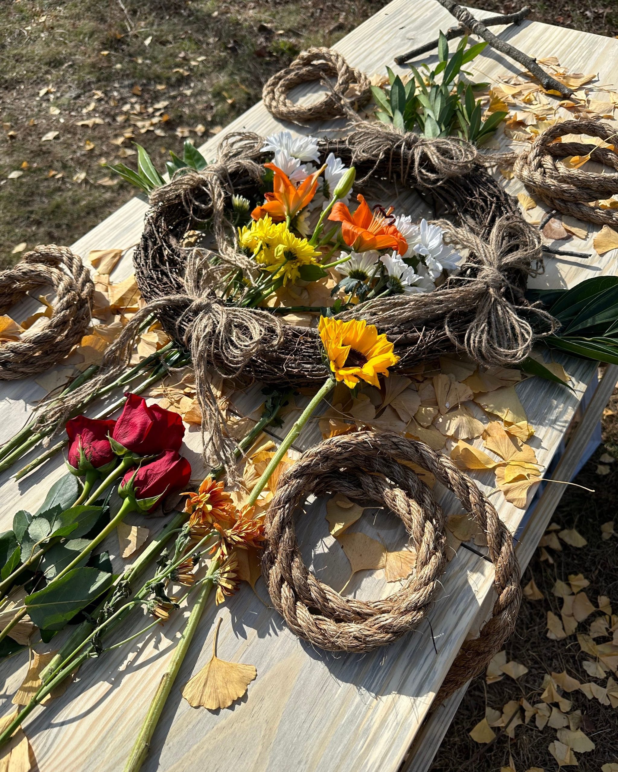  A pine box casket is decorated with flowers and prepared for a natural, green burial at Larkspur. 