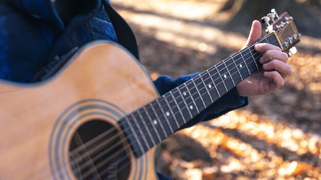  A man playing holiday music at the grave of his loved one. 