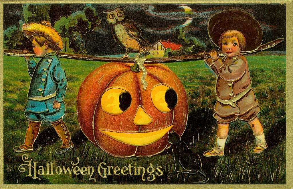 A vintage Halloween greeting card with two boys dressed in colonial clothing carrying a jack-o-lantern on a stick.